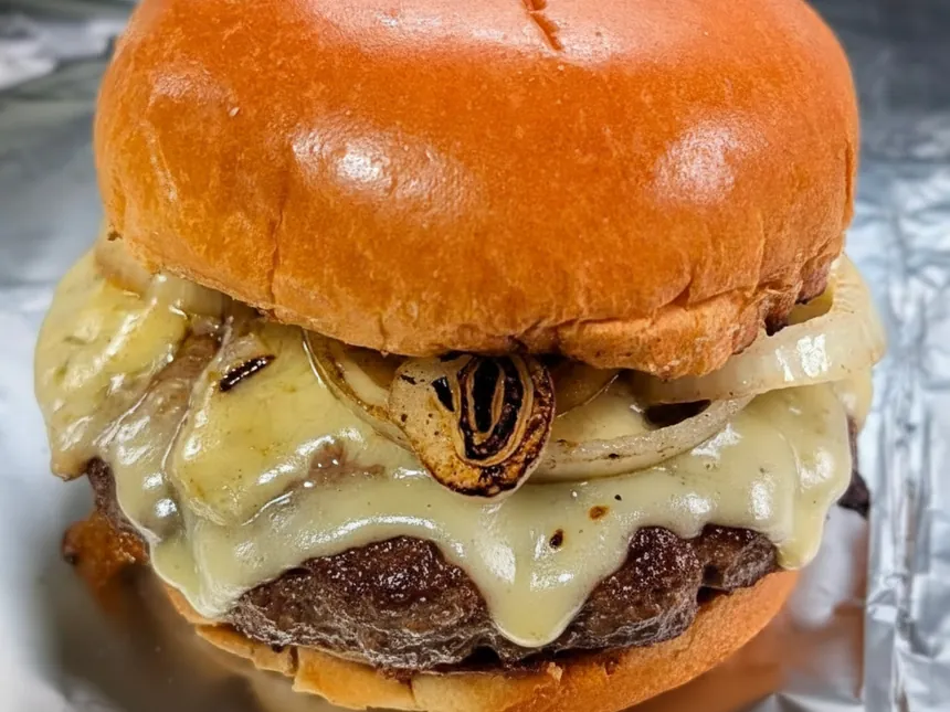 Barney's cheeseburger — griddled beef patty, melted cheese and caramelised onions on a brioche bun